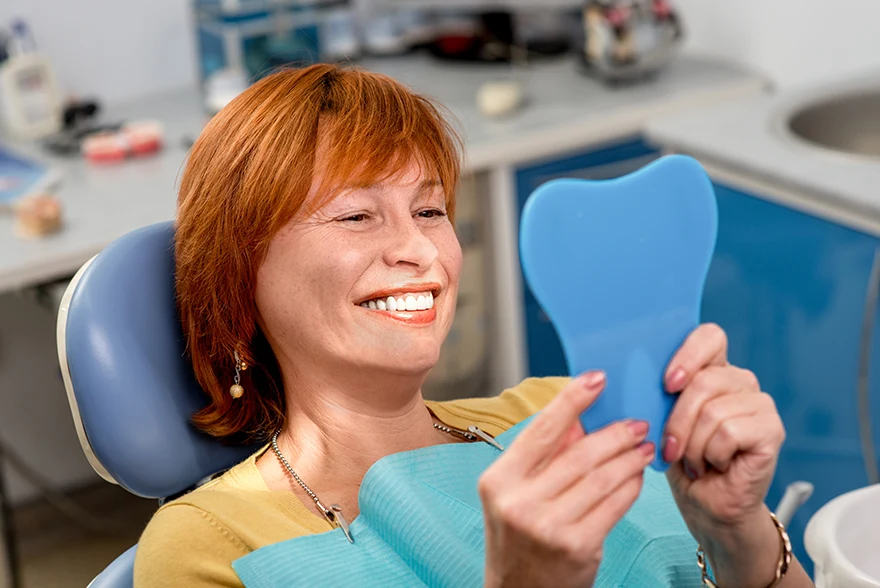 Happy patient smiling after wisdom tooth extraction surgery in Jacksonville, FL