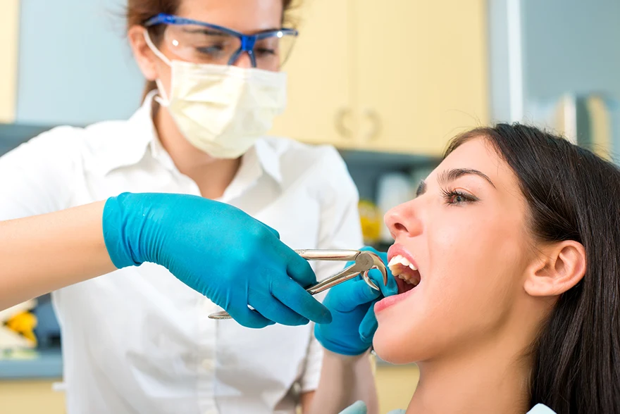 Image showing a woman getting a procedure for tooth extraction in Jacksonville, FL
